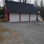Finished garage with white doors
