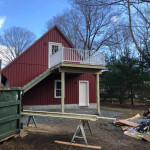 Detached garage with stairs and deck