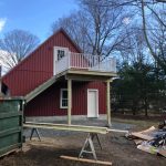 Detached garage with stairs and deck