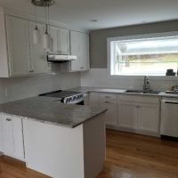 White kitchen cabinets with high-end countertops