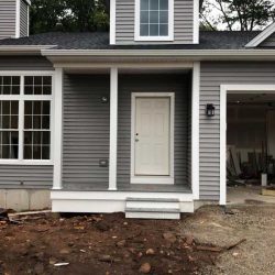New construction, front view with siding
