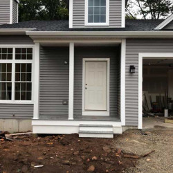 New construction, front view with siding