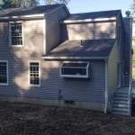 Back of new construction, with windows and siding